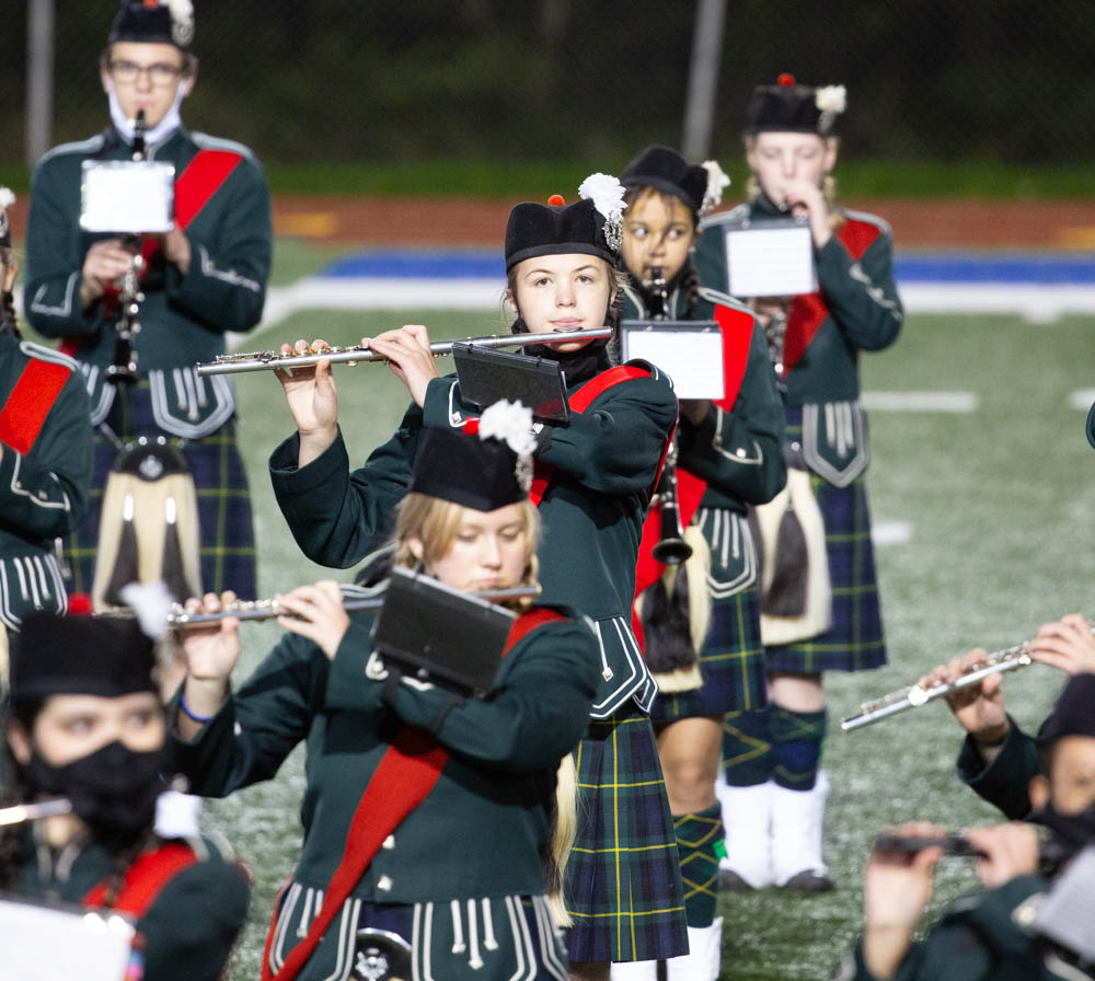 The author's daughter (center, on flute) performing with the marching band during half time.