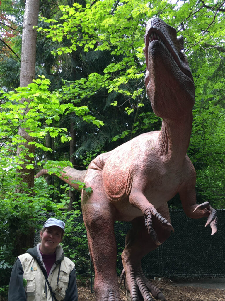 The author at Dinosaur Discovery, summer 2021. Part of my role was watering the plants in half of the exhibit before guests arrived.