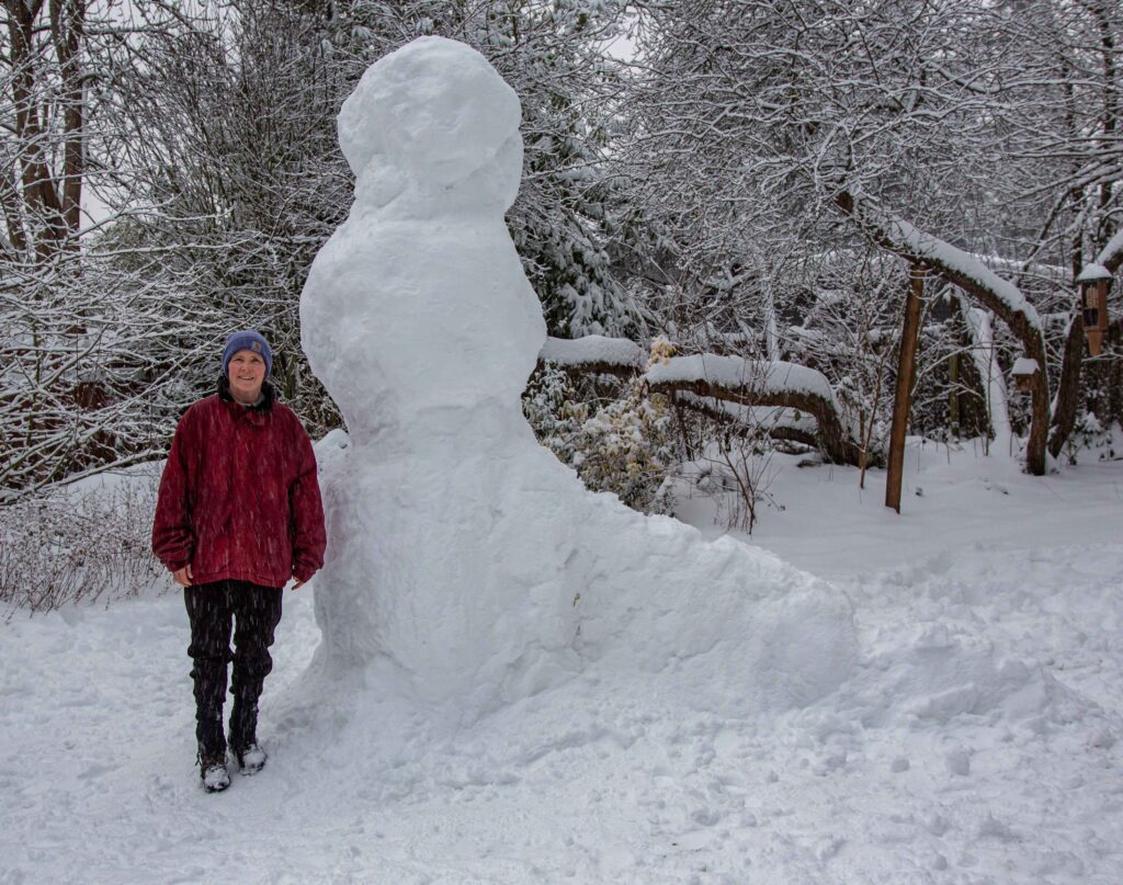 The ten-foot tall snowman my husband, daughter and I built during perfect snow conditions in February, 2021. Slow down and enjoy.