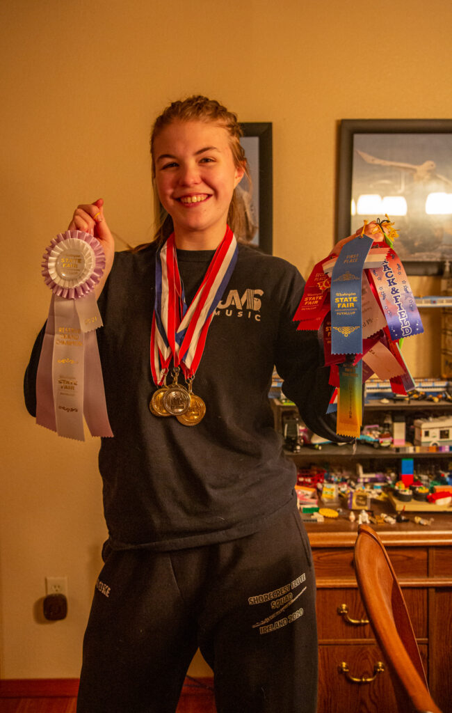 My daughter with a wide assortment of ribbons. I used to worry about becoming a "helicopter parent" until I learned how to loosen the reins and let her make mistakes -- and learn from them.