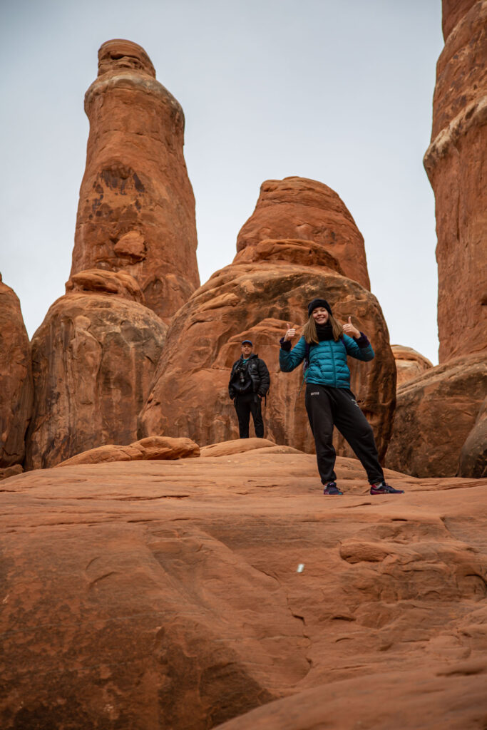 Red rock sandstone of the Fiery Furnace. The author's husband and daughter before towering spires.