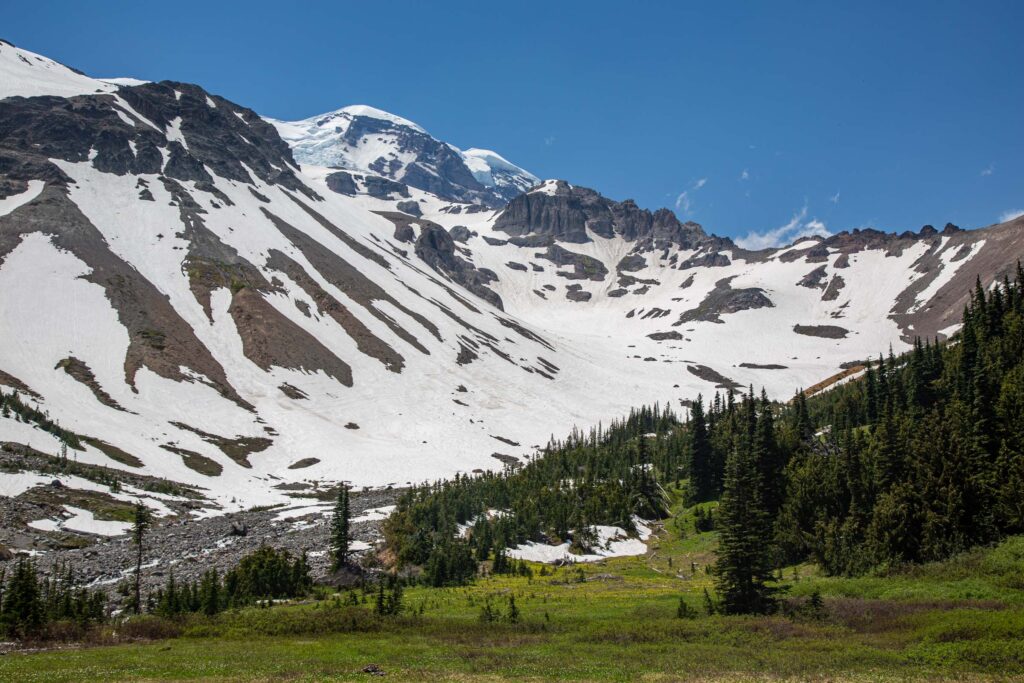 Glacier Basin, about 3 miles from the parking lot, where many groups start to take their first rest break and soak up the view of the Inner Glacier, a steep climb on the way to Camp Schurman. Knowing what to expect helps you be mentally prepared.