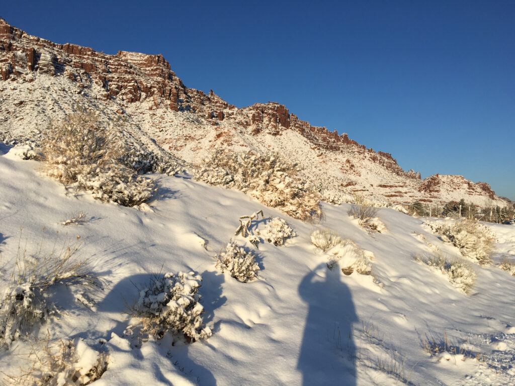 On one of my "Freedom walks" which I take most mornings in every new place I visit, I often look for my shadow. Here, I'm set against red rock, white snow, and crisp blue sky.