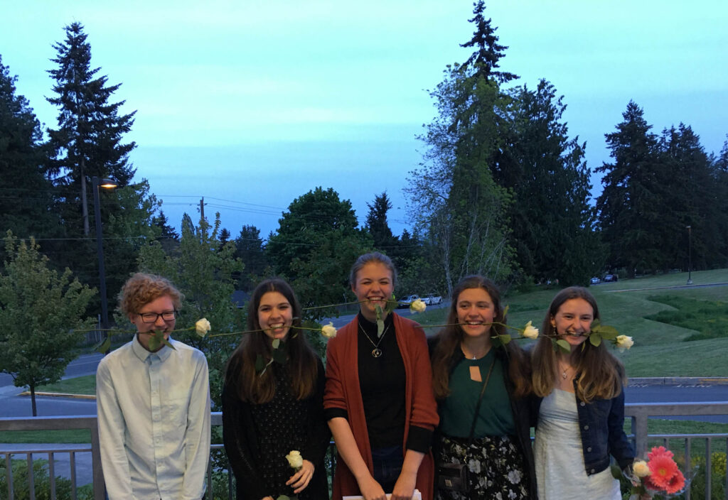 Happy high school seniors celebrating after a recent awards ceremony. If we can teach our kids to reframe self-talk, they can focus on positives rather than loss.