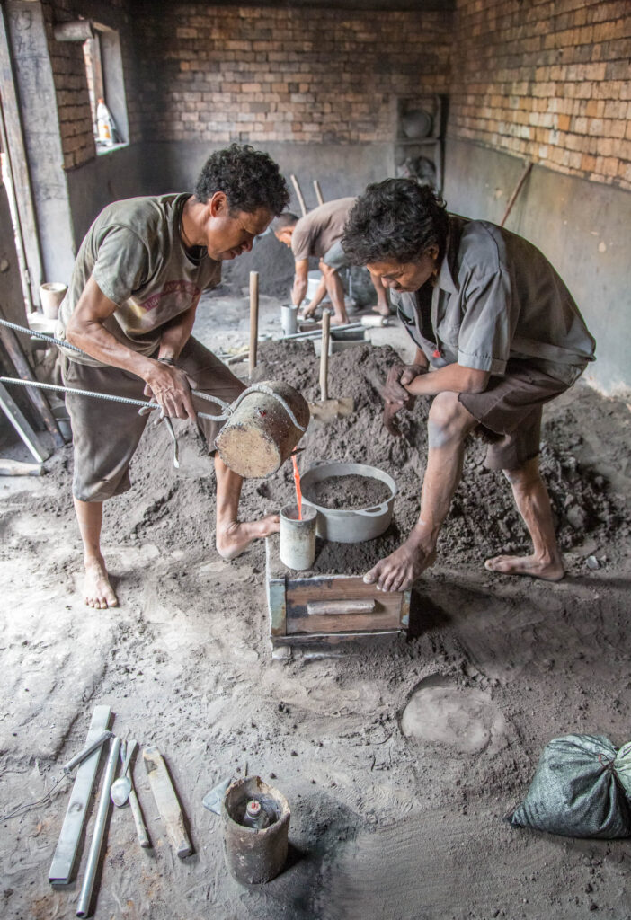 Typical work conditions in Madagascar. These gentlemen were working with molten liquid without protective footwear, eyewear, or even mitts. I will never again complain about work conditions in the US.