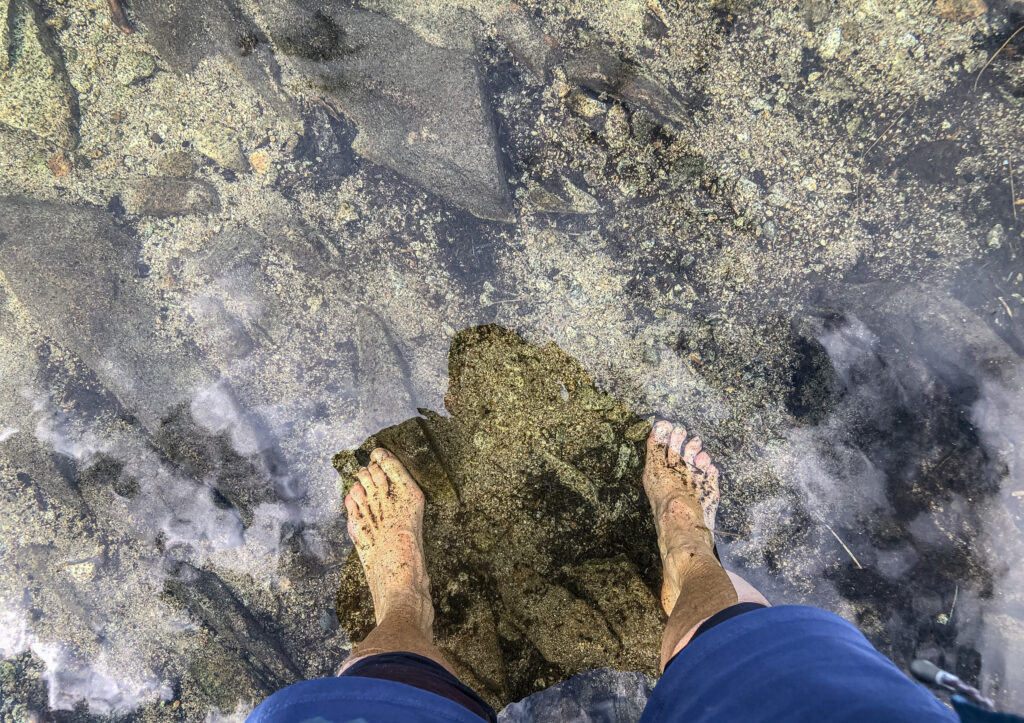 New-to-me experience of soaking my feet in Island Lake while reading a chapter from a book.