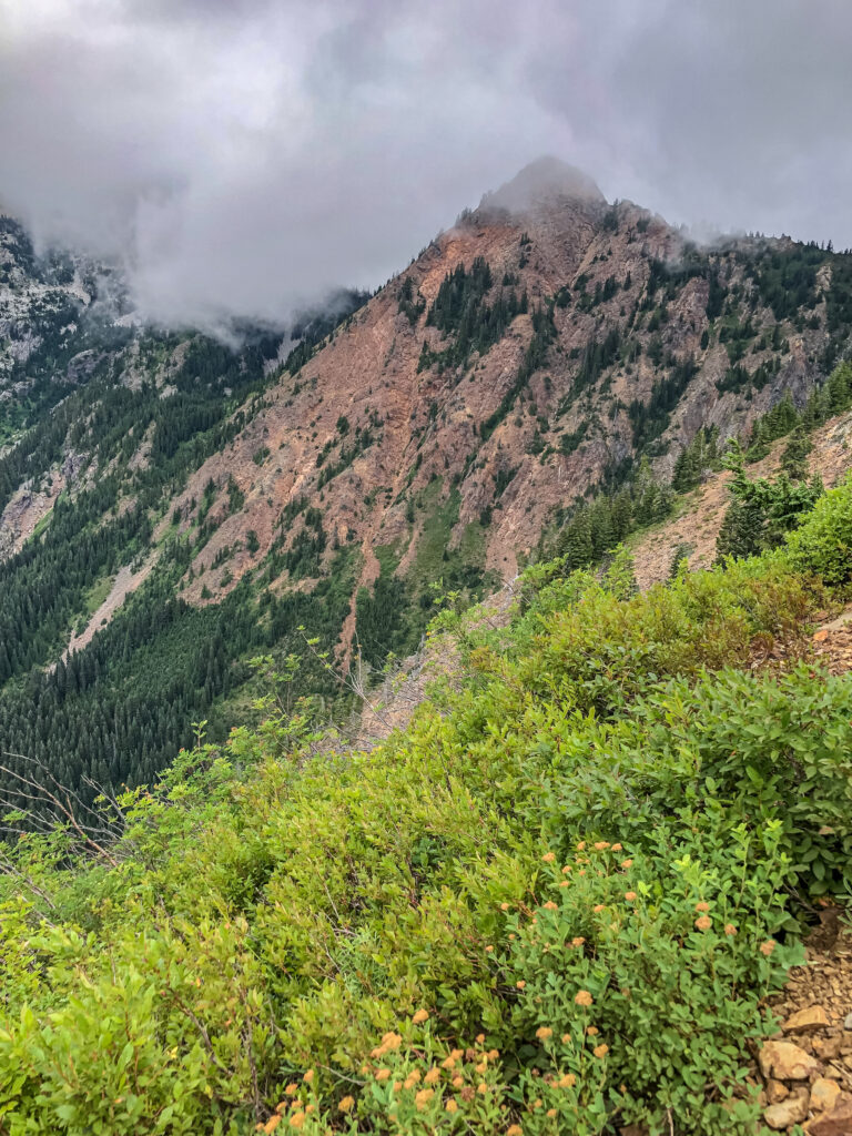 Red Mountain bathed in early morning fog on the approach to Kendall Katwalk.