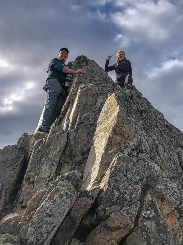 The author's husband and teenage daughter pose for a picture on the "summit" of a Savage River scramble overlooking the parking lot.