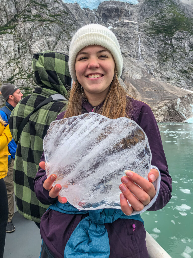 Our daughter holds a chunk of glacier ice that was saved and shaved for margaritas.