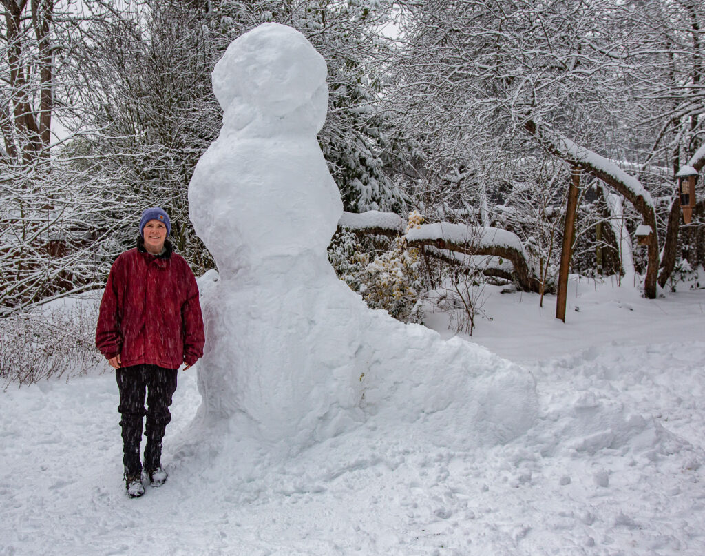 The tallest snow creation we've ever made. For reference, I'm 5'6" and this guy, built on February 13, 2021, was a good eight feet tall.