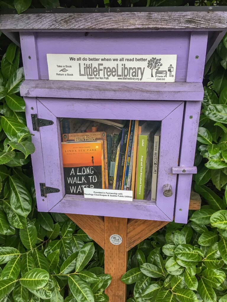 We visited six Little Free Libraries in our neighborhood. "Take a book, return a book" is the organization's slogan. 