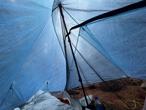 This little bubble of a tent may seem peaceful and reasonably cozy. Adding the soundtrack of the howling wind and the constant downpour on my refuge's canopy would make this feel a whole lot different.