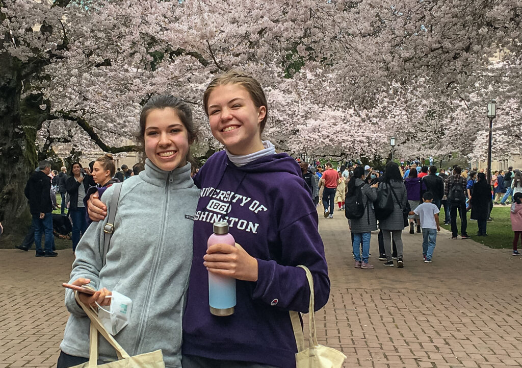 A beaming pair of friends at "Prospective Students Day" on March 26, 2022, along with thousands of weekend spectators.