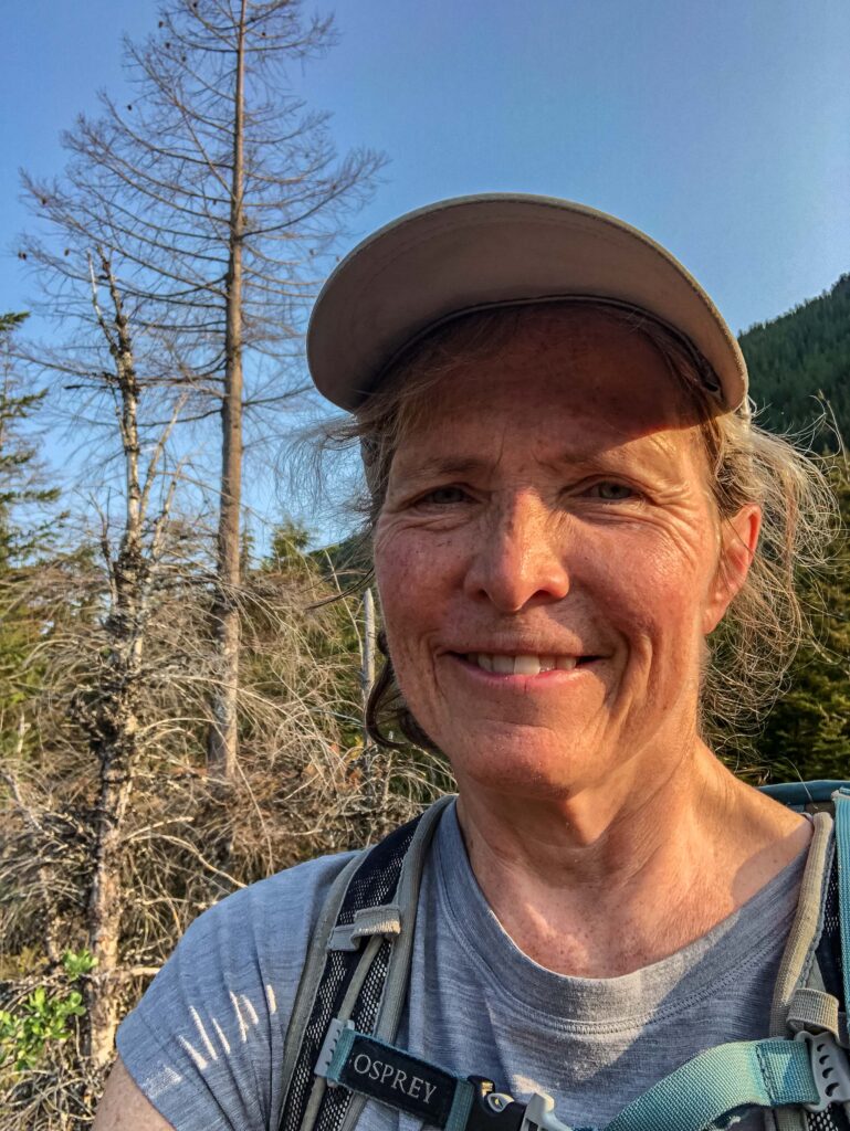 Happy author selfie. Anything that gets me outdoors to fresh air, birdsong, solitude, and beauty makes me smile. And when I think we've reached our turnaround point but I find a safe way forward, I'm even happier.