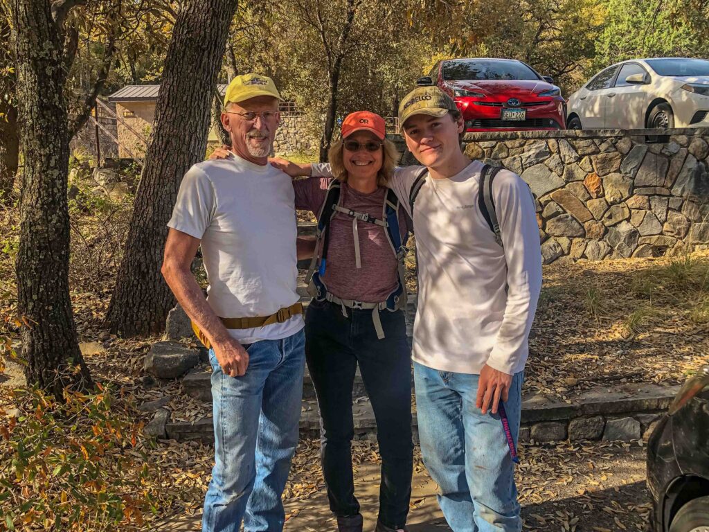 The Keyes family poses in the parking lot: Walt, Pam, and their son Zach.