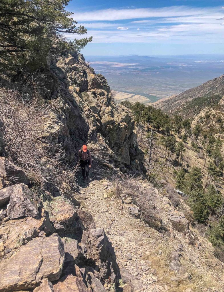 Pam continues at a steady pace with Old Baldy Saddle behind her.