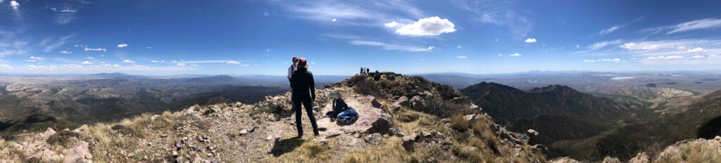 Panorama of the summit of Mt. Wrightson. Zach started down before us. Lessons in humility include carrying more water than you expect to need.