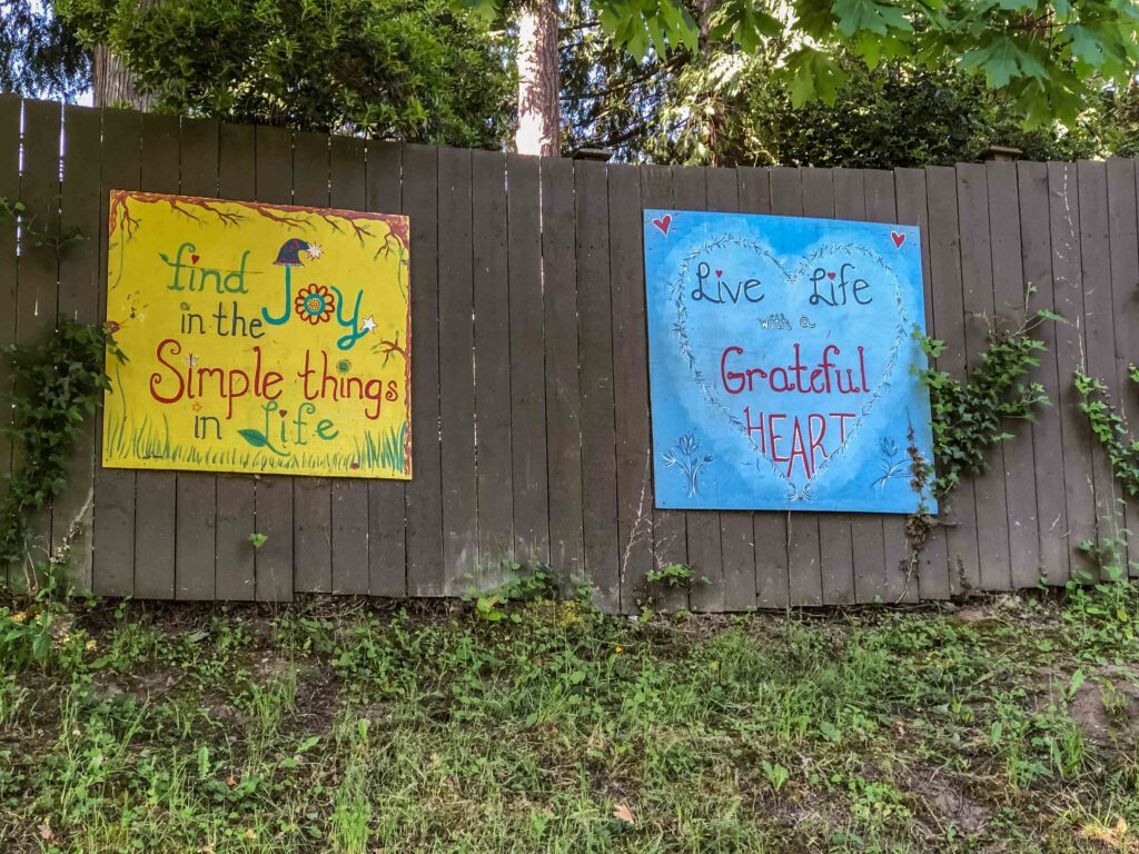 My murky middle nearly caused me to give up after 39 rambles. Decorative signs hang on the fencing leading to the public boat ramp at Haller Lake. For all they do to try to welcome people, it's the last thing I felt.