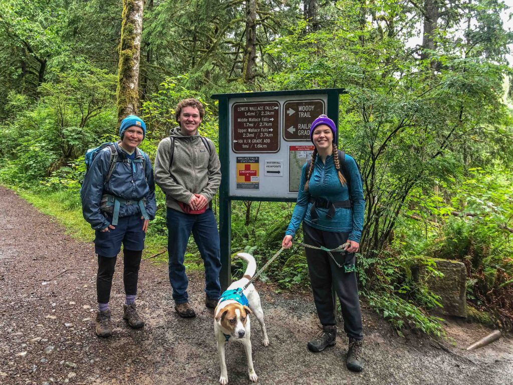 Group photo of me, Zach, Ajax, and Brooke at the start of the Woody Trail, our route to Wallace Falls.