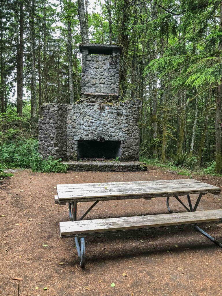 A picnic table set at Bullitt Fireplace, all that remains of the Bullitt Family cabin.