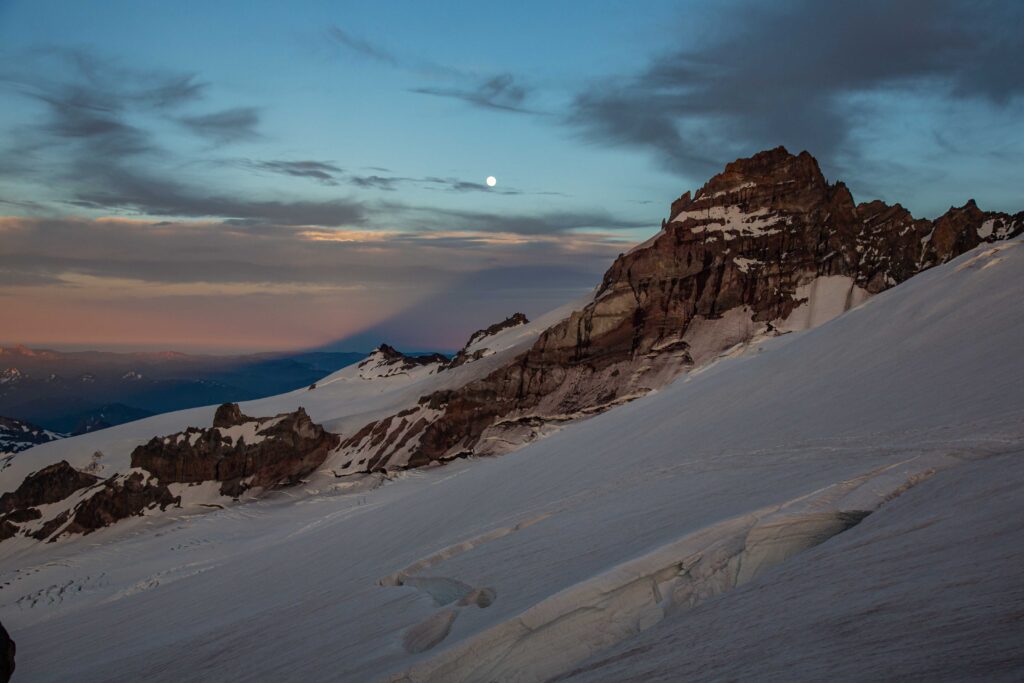 Trainer or coach? Depends on whether you want to be told exactly what to do or get guidance on a climb. A personal trainer will provide training programs. A climbing coach or guide might actually take you up the mountain.