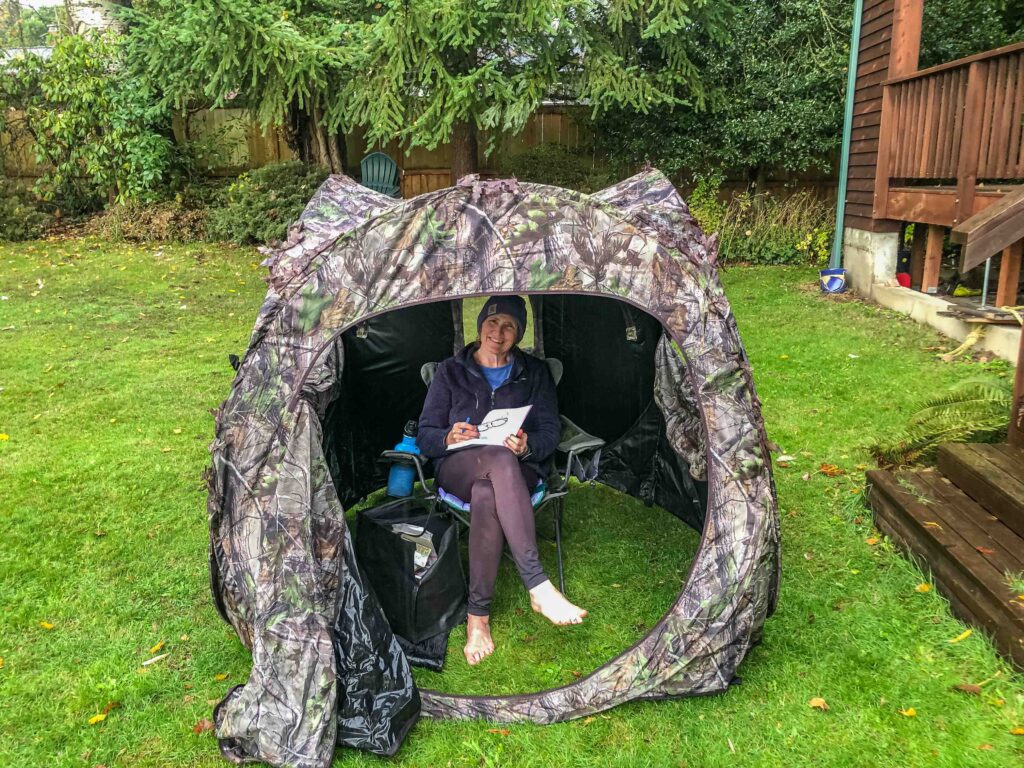 Grounding in the rain inside my bird blind tent. The other day my feet got so cold, I borrowed water from our hot tub to alternate soaks.