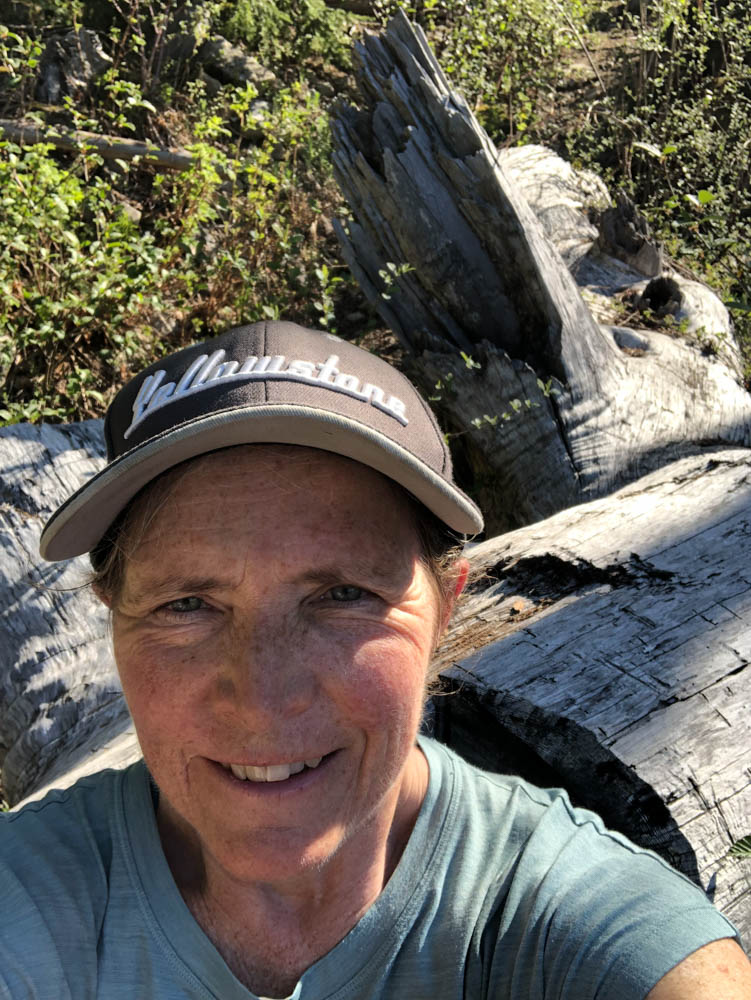 The author pauses for a selfie and snack about a mile from the summit of Dirty Harry's Peak where there are some lovely logs carved into seats.
