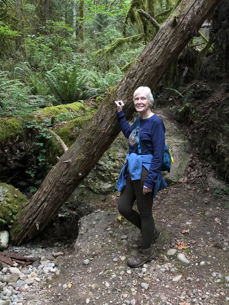 A happy Cathy on her way to becoming a seasoned hiker on Squak Mountain.