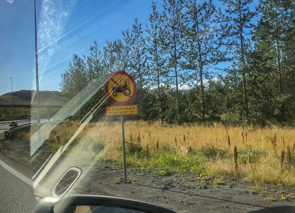 This sign says "No tractors allowed on the freeway between 7-9 a.m. and 3-6 p.m."