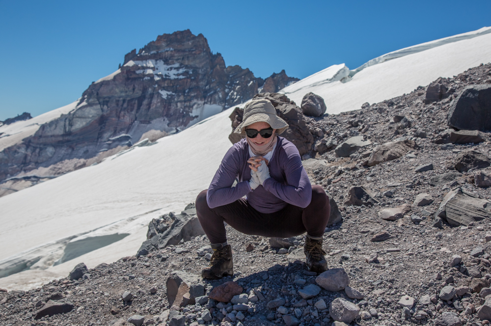 Atomic Habits reminds me that self-care includes the Frog stretch on Mt. Rainier with Little Tahoma behind me.