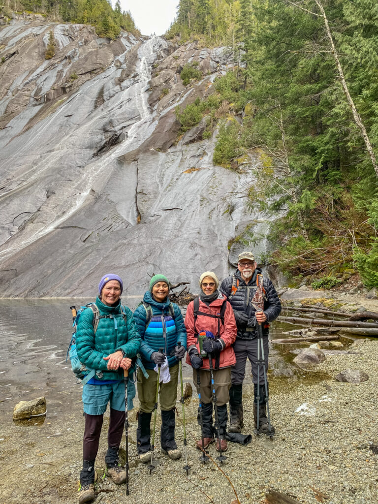 Our crew poses in front of Otter Falls on a dry winter day. Each hike allows me to create new meaning and learn about what works best.